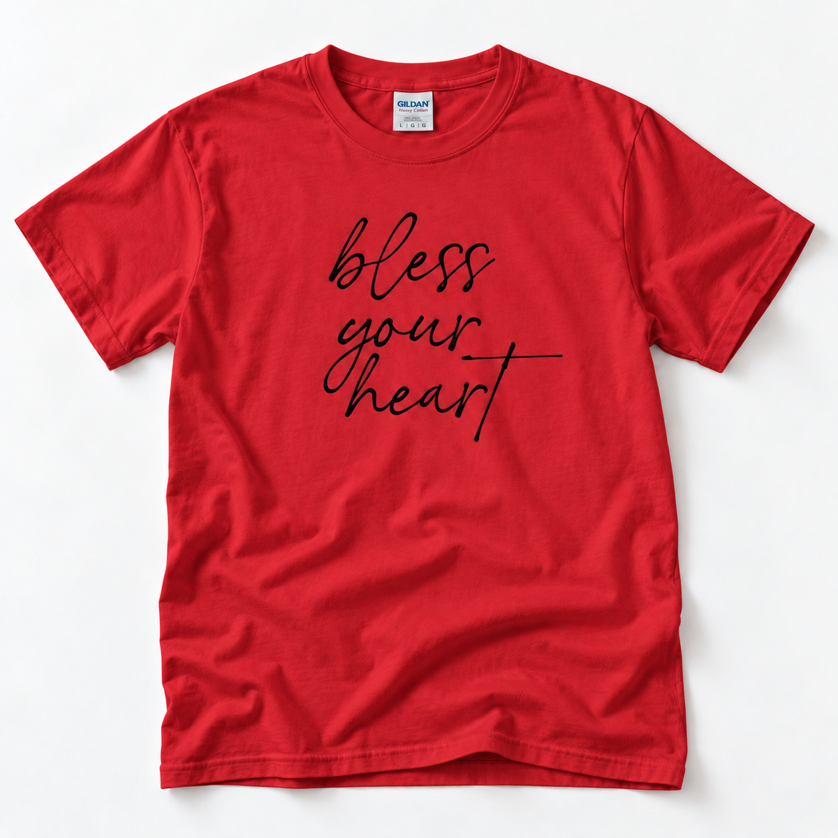 Red Bless Your Heart adult T-shirt laid flat with black script lettering.