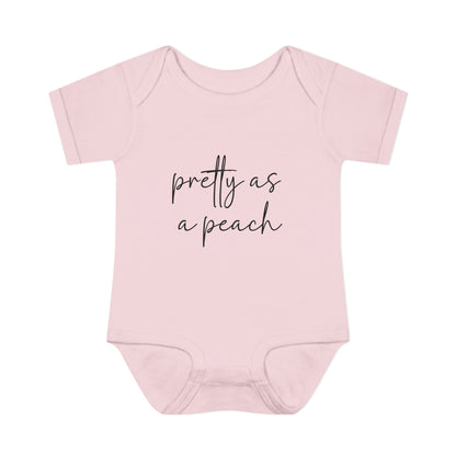 Ballerina Pretty as a Peach baby bodysuit, front product mockup showing the script design.