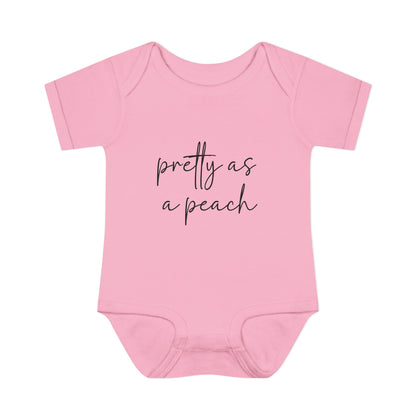 Pink Pretty as a Peach baby bodysuit, front product mockup showing the script design.