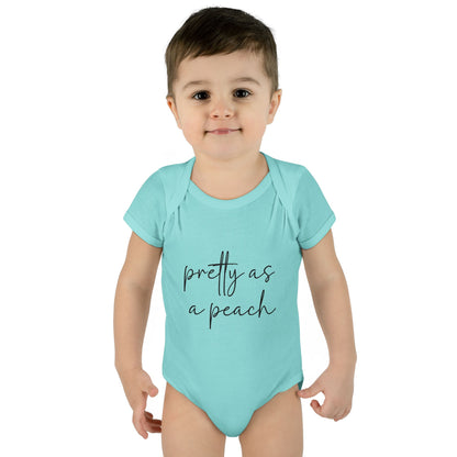 Chill Pretty as a Peach baby bodysuit, worn on a toddler model.