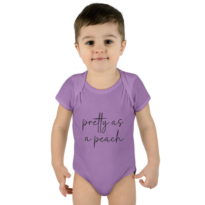 Lavender Pretty as a Peach baby bodysuit, worn on a toddler model.
