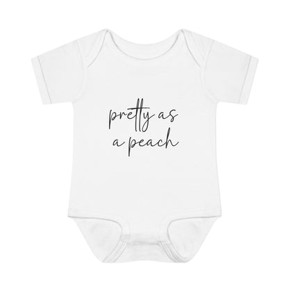 White Pretty as a Peach baby bodysuit, front product mockup showing the script design.