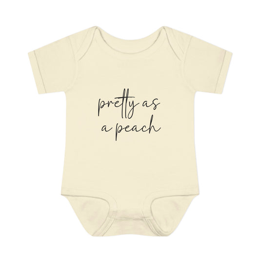 Natural Pretty as a Peach baby bodysuit, front product mockup showing the script design.