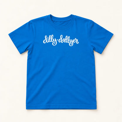 Cobalt Dilly-Dallyer kids tee with white script, flat on a cream background