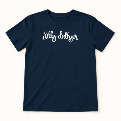 Navy Dilly-Dallyer kids tee with white script, flat on a cream background