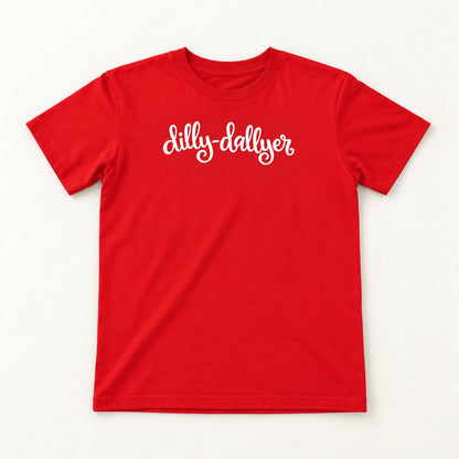 Red Dilly-Dallyer kids tee with white script, flat on a cream background