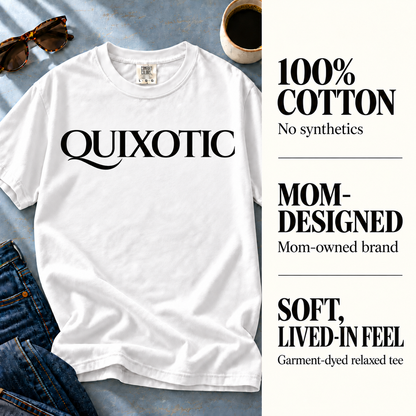 White Quixotic tee beside 100% cotton, mom-owned brand, and garment-dyed fabric details.
